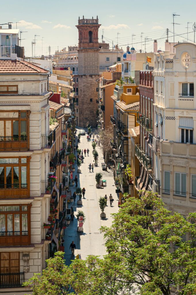 View at Valencia downtown with people walking in the street. Rooftops of Valencia downtown. Spain.